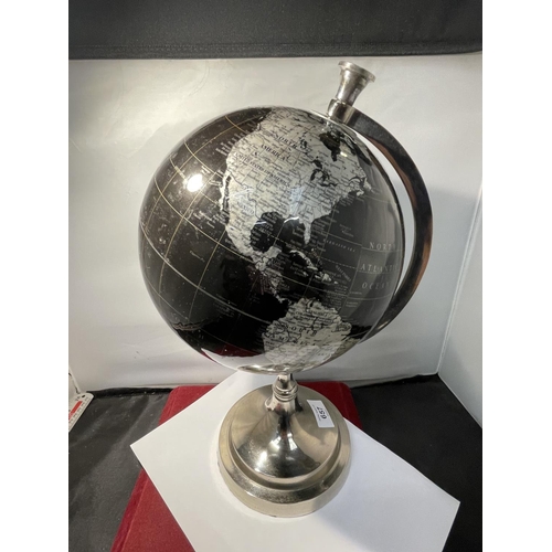 657 - A WORLD GLOBE ON A CHROME STAND