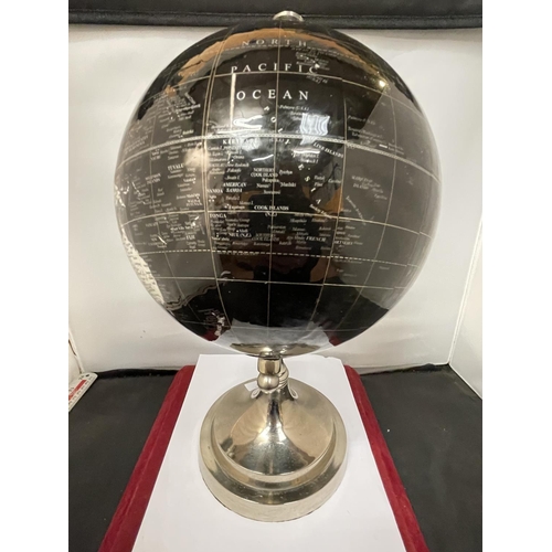 657 - A WORLD GLOBE ON A CHROME STAND