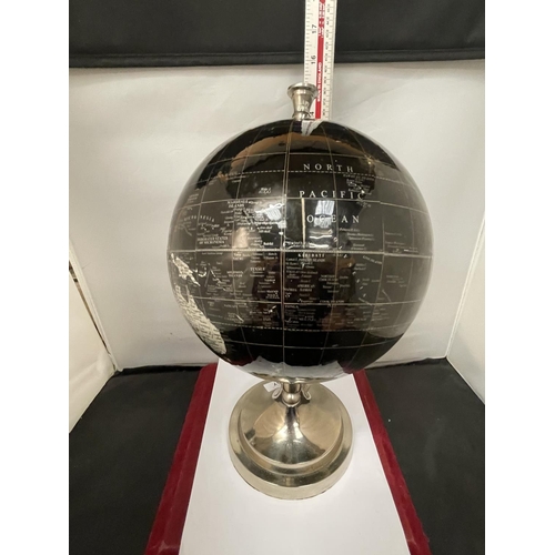 657 - A WORLD GLOBE ON A CHROME STAND