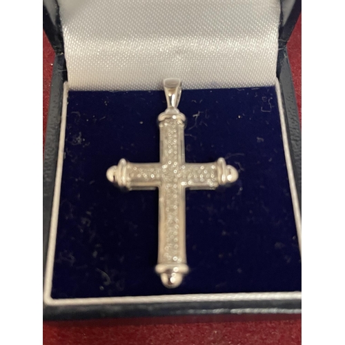 673 - A 9CT WHITE GOLD CROSS