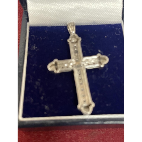 673 - A 9CT WHITE GOLD CROSS