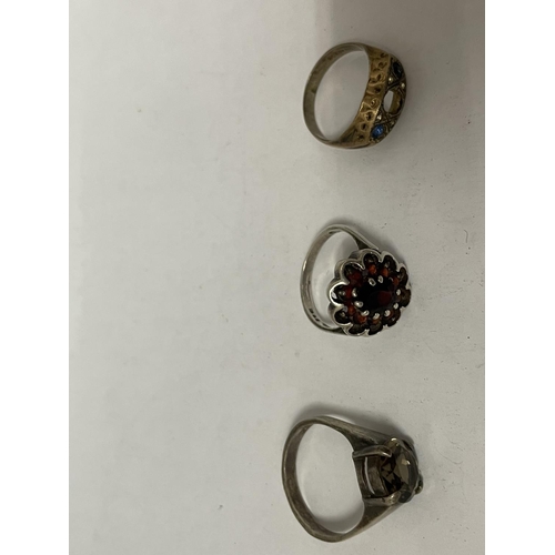 793 - NINE VARIOUS MARKED SILVER RINGS AND A STAGS HEAD BROOCH