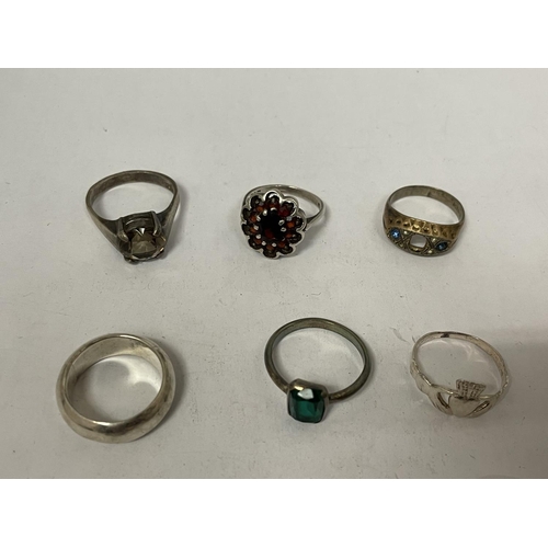 793 - NINE VARIOUS MARKED SILVER RINGS AND A STAGS HEAD BROOCH