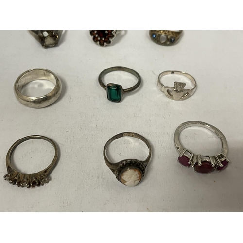 793 - NINE VARIOUS MARKED SILVER RINGS AND A STAGS HEAD BROOCH