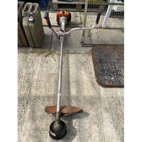 1700 - A STHIL PETROL GRASS STRIMMER BELIEVED IN WORKING ORDER BUT NO WARRANTY