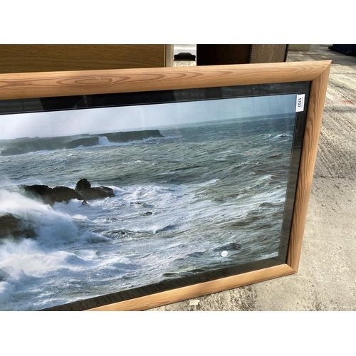 1707 - A LARGE WOODEN FRAMED PRINT OF A CLIFF SCENE