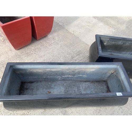 1769 - A PAIR OF LOW BLACK FIBRE GLASS GARDEN PLANTERS (H:36CM W:98CM)