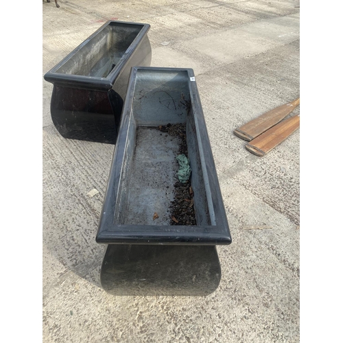 1769 - A PAIR OF LOW BLACK FIBRE GLASS GARDEN PLANTERS (H:36CM W:98CM)