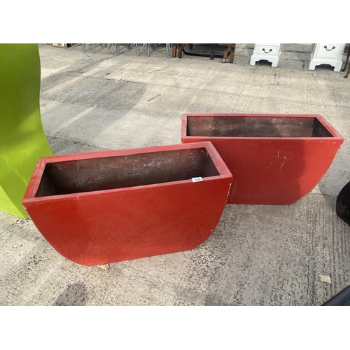 1770 - A PAIR OF LOW RED FIBRE GLASS PLANTERS (H:45CM W:75CM)