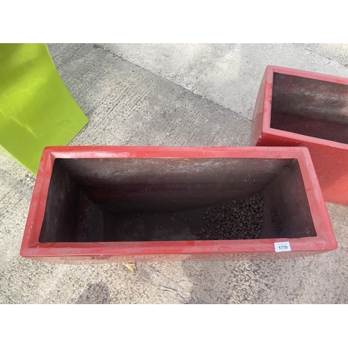 1770 - A PAIR OF LOW RED FIBRE GLASS PLANTERS (H:45CM W:75CM)