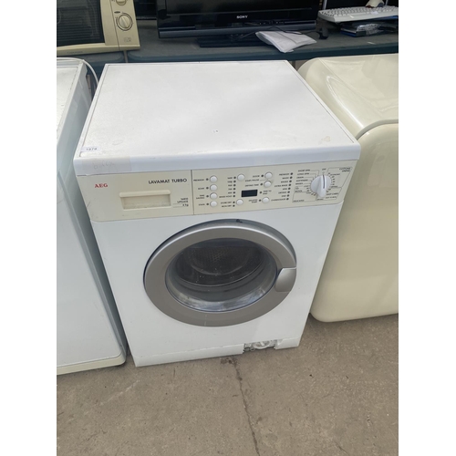 1879 - A WHITE AEG WASHING MACHINE BELIEVED IN WORKING ORDER BUT NO WARRANTY