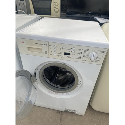 1879 - A WHITE AEG WASHING MACHINE BELIEVED IN WORKING ORDER BUT NO WARRANTY