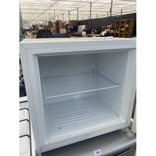 1885 - A WHITE ZANUSSI COUNTER TOP FRIDGE BELIEVED IN WORKING ORDER BUT NO WARRANTY