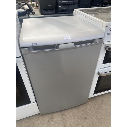 1886 - A SILVER BEKO UNDER COUNTER FRIDGE BELIEVED IN WORKING ORDER BUT NO WARRANTY