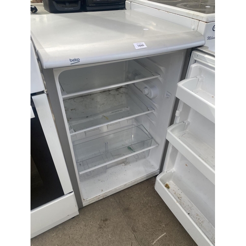 1886 - A SILVER BEKO UNDER COUNTER FRIDGE BELIEVED IN WORKING ORDER BUT NO WARRANTY