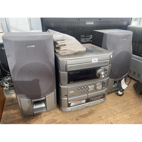 1913 - AN AIWA STEREO SYSTEM WITH TWO SPEAKERS