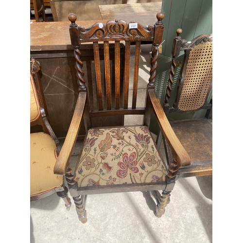 2157 - AN EARLY 20TH CENTURY OAK ELBOW CHAIR ON BARLEY TWIST SUPPORTS AND SIMILAR DINING CHAIR