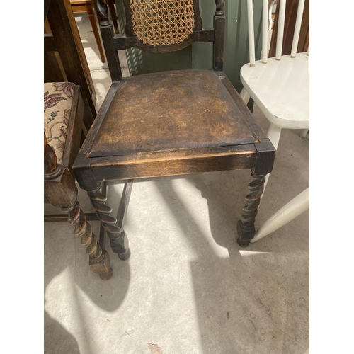 2157 - AN EARLY 20TH CENTURY OAK ELBOW CHAIR ON BARLEY TWIST SUPPORTS AND SIMILAR DINING CHAIR