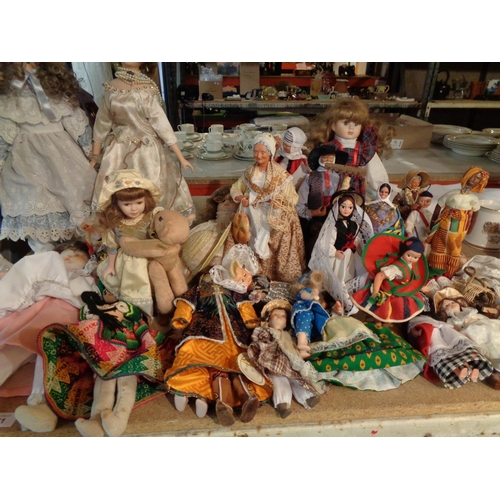 841 - A LARGE COLLECTION OF DECORATIVE DOLLS OF VARIOUS NATIONALITIES