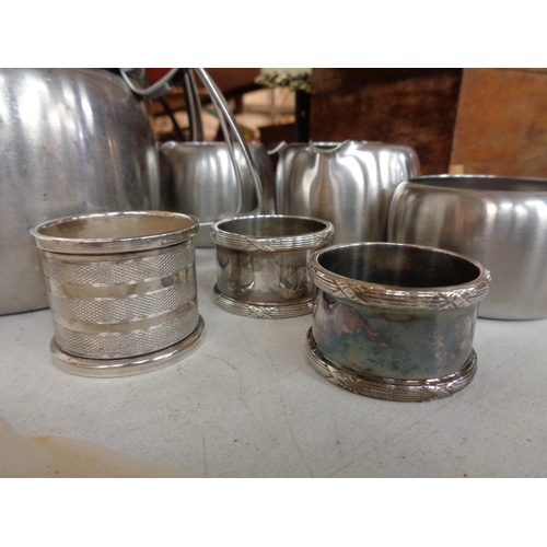 874 - A GROUP OF STAINLESS STEEL TEA AND COFFEE ITEMS TO ALSO INCLUDE THREE SILVER PLATED NAPKIN RINGS