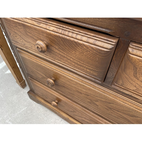 2210 - AN ERCOL ELM CHEST OF TWO SHORT AND TWO LONG DRAWERS, 40