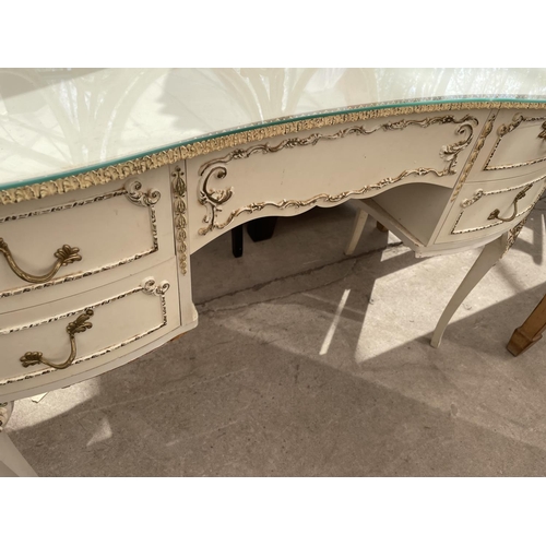 2211 - A CREAM AND GILT DRESSING TABLE WITH TRIPLE MIRROR