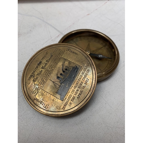 22 - A BRASS COMPASS WITH ENGRAVING RELATING TO THE TITANIC