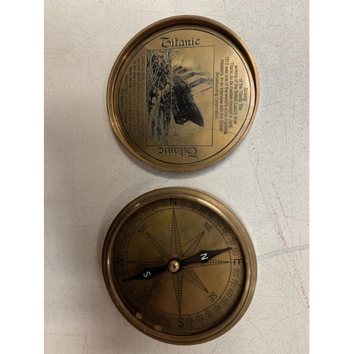 22 - A BRASS COMPASS WITH ENGRAVING RELATING TO THE TITANIC