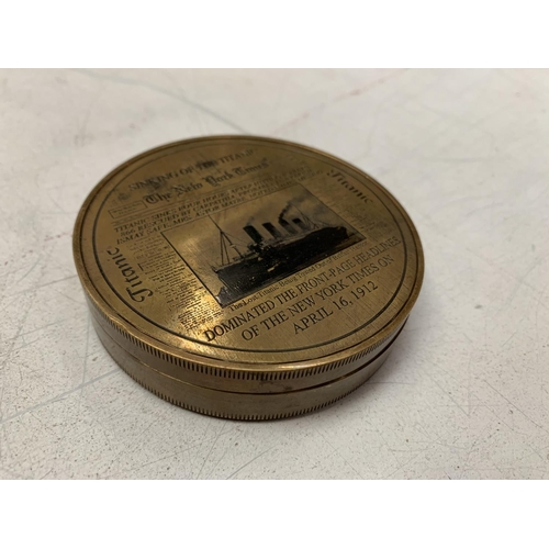 22 - A BRASS COMPASS WITH ENGRAVING RELATING TO THE TITANIC