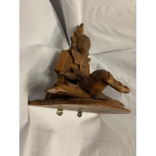 23 - A CARVED WOODEN WALL SCONCE DEPICTING AN EAGLE AND A THISTLE 30.5CM X 35CM