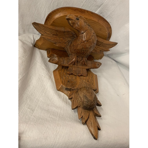 23 - A CARVED WOODEN WALL SCONCE DEPICTING AN EAGLE AND A THISTLE 30.5CM X 35CM