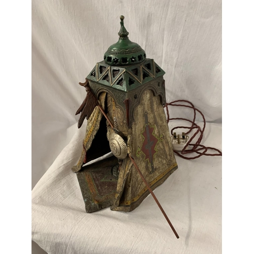 24 - A BERGMAN STYLE COLD PAINTED BRONZE LAMP DEPICTING AN AFRICAN TRIBESMAN IN A TENT - HEIGHT APPROXIMA... 