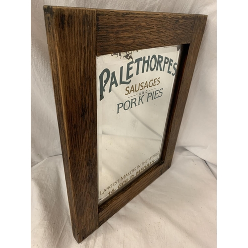 26 - A WOODEN FRAMED ARTS AND CRAFTS STYLE ADVERTISING MIRROR FOR 'PALETHORPES SAUSAGES AND PORK PIES'