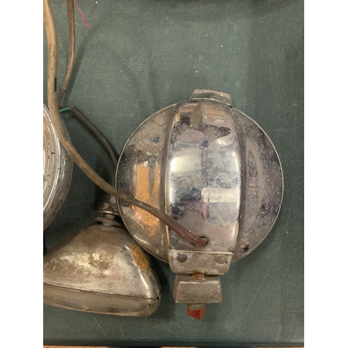 312 - A PAIR OF VINTAGE LUCAS CAR HEADLIGHTS TO ALSO INCLUDE AN INDICATOR LAMP