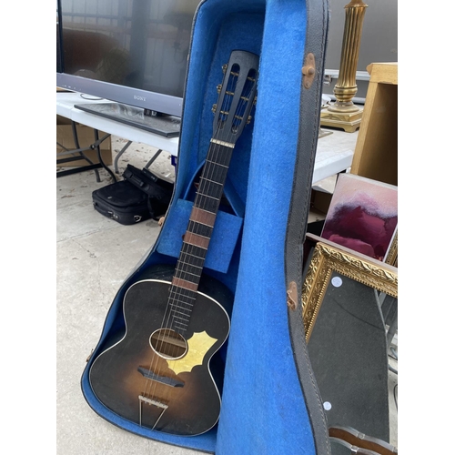 1923 - A CASED ACUSTIC GUITAR