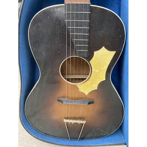 1923 - A CASED ACUSTIC GUITAR