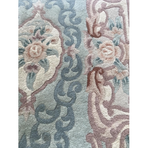 1993 - A GREEN PATTERNED RUG