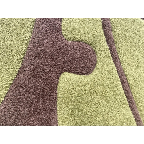 1998 - A MODERN CREAM RUG AND A MODERN GREEN AND BROWN RUG