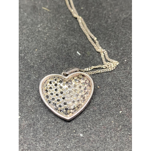 507 - A MARKED 925 SILVER PENDANT WITH BI COLOUR HEART SHAPED FOB IN A PRESENTATION BOX