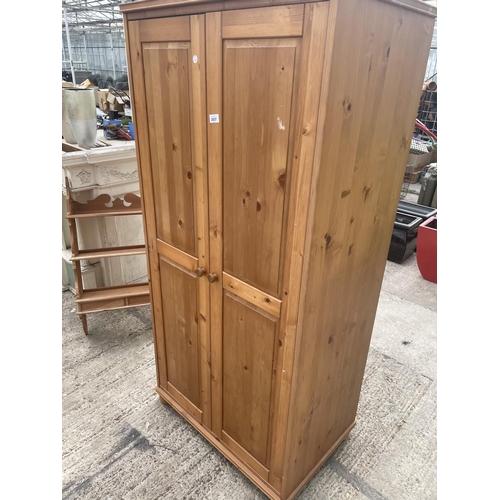 2537 - A MODERN TWO DOOR PINE WARDROBE 31