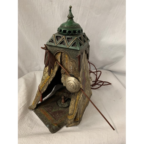 24 - A BERGMAN STYLE COLD PAINTED BRONZE LAMP DEPICTING AN AFRICAN TRIBESMAN IN A TENT - HEIGHT APPROXIMA... 