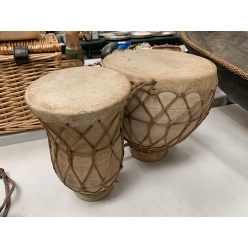 189 - A POTTERY AND HIDE BONGO DRUM DUO