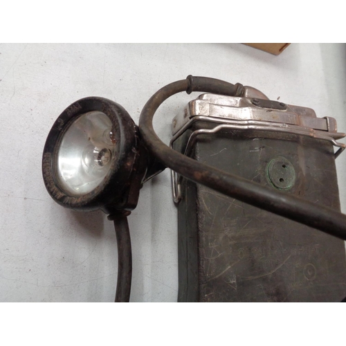 269 - A VINTAGE MINERS LAMP AND BATTERY