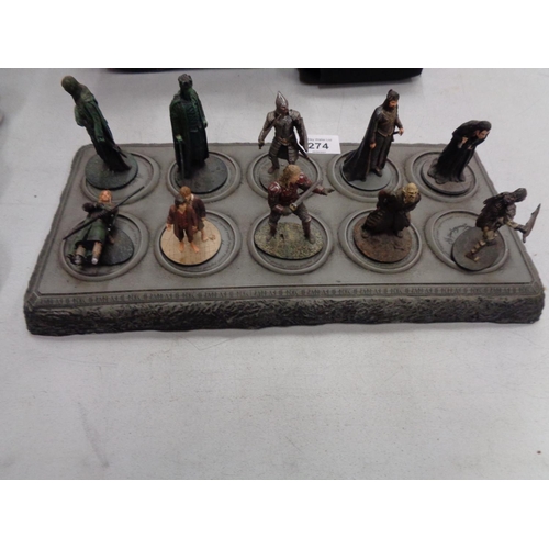 274 - A COLLECTION OF TEN LORD OF THE RINGS FIGURES ON A DISPLAY STAND