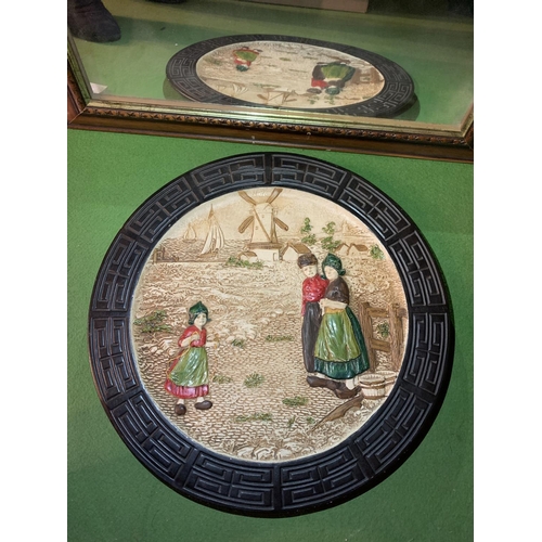 451 - A LARGE DECORATIVE WALL CHARGER WITH EMBOSSED DEPICTION OF A DUTCH SCENE AND A MAHOGNAY FRAMED MIRRO... 