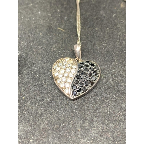 507 - A MARKED 925 SILVER PENDANT WITH BI COLOUR HEART SHAPED FOB IN A PRESENTATION BOX