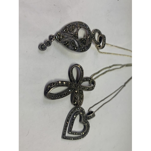 532 - THREE SILVER NECKLACES WITH MARCASITE STONE PENDANTS TO INCLUDE A HEART AND A CROSS ETC