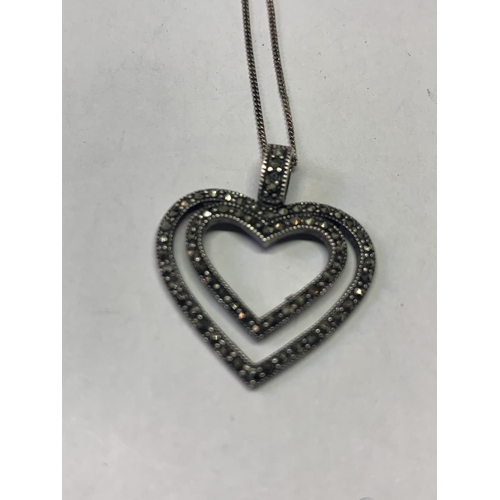 532 - THREE SILVER NECKLACES WITH MARCASITE STONE PENDANTS TO INCLUDE A HEART AND A CROSS ETC