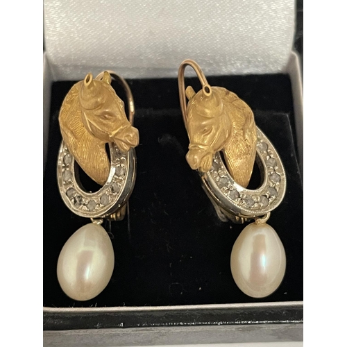 573 - A PAIR OF 9 CARAT WHITE AND YELLOW GOLD HORSES HEAD WITH HORSE SHOE DESIGN EARRINGS WITH DIAMONDS AN... 