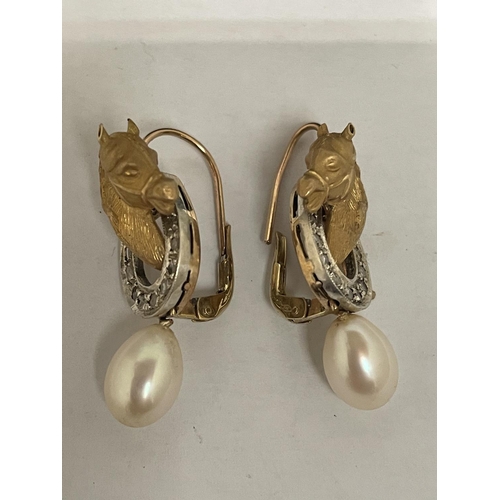 573 - A PAIR OF 9 CARAT WHITE AND YELLOW GOLD HORSES HEAD WITH HORSE SHOE DESIGN EARRINGS WITH DIAMONDS AN... 